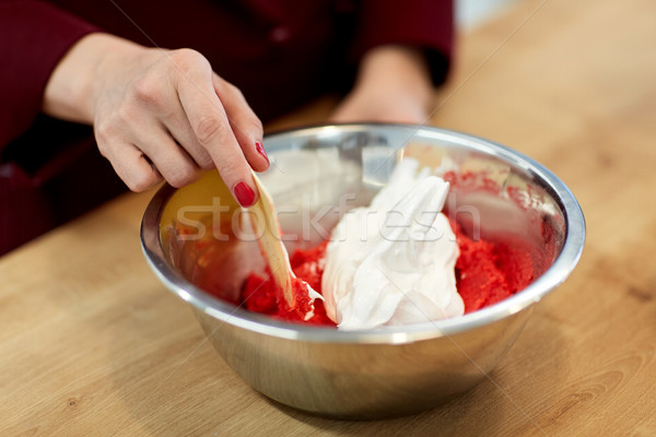 chef making macaron batter at confectionery Stock photo © dolgachov