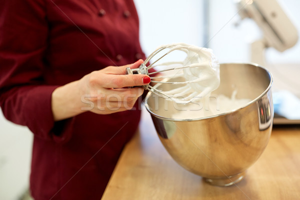 chef with whisk and whipped egg whites at kitchen Stock photo © dolgachov