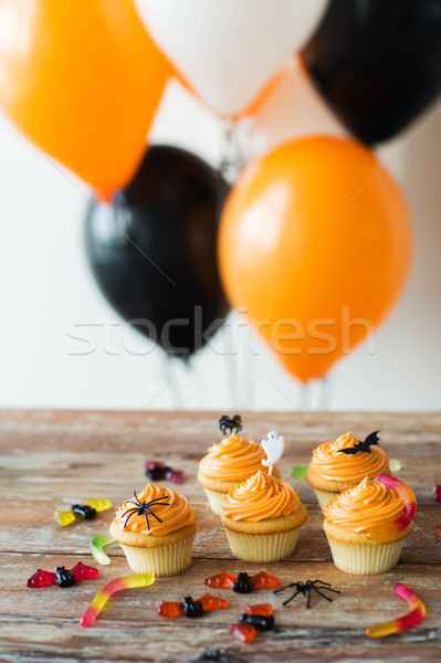 Stock photo: halloween party cupcakes and candies on table