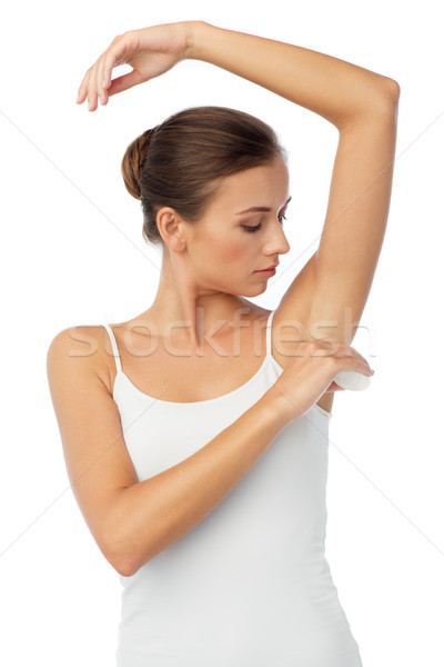 woman with antiperspirant deodorant over white Stock photo © dolgachov
