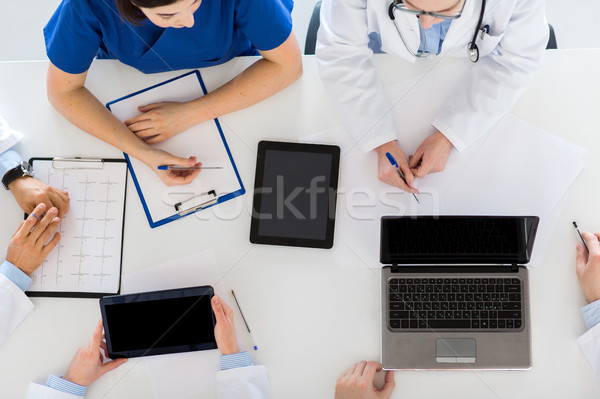 doctors with cardiogram and computers at hospital Stock photo © dolgachov