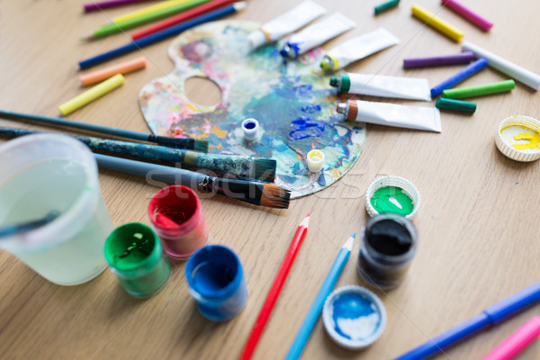 color palette, brushes and paint tubes on table Stock photo © dolgachov