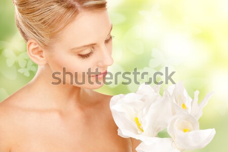 beautiful woman with madonna lily Stock photo © dolgachov