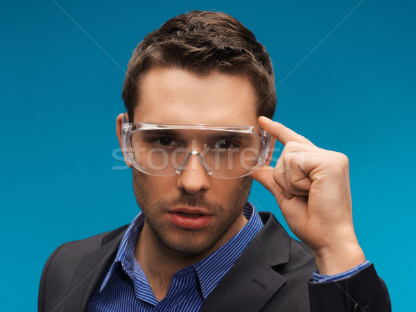 businessman in protective glasses Stock photo © dolgachov
