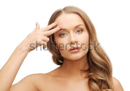Piękna kobieta wskazując czoło zdjęcie kobieta ręce Zdjęcia stock © dolgachov