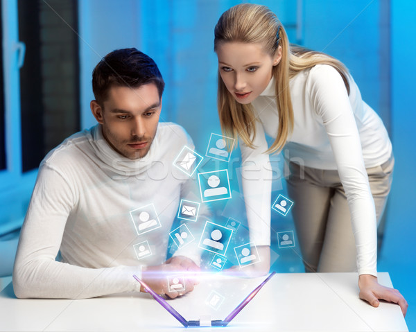 man and woman working with virtual screen Stock photo © dolgachov