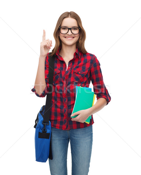 Mosolyog női diák táska jegyzetfüzetek oktatás Stock fotó © dolgachov