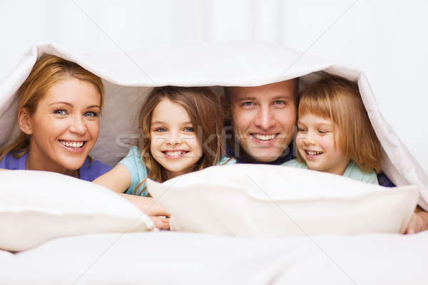 Boldog család kettő gyerekek pléd otthon család Stock fotó © dolgachov