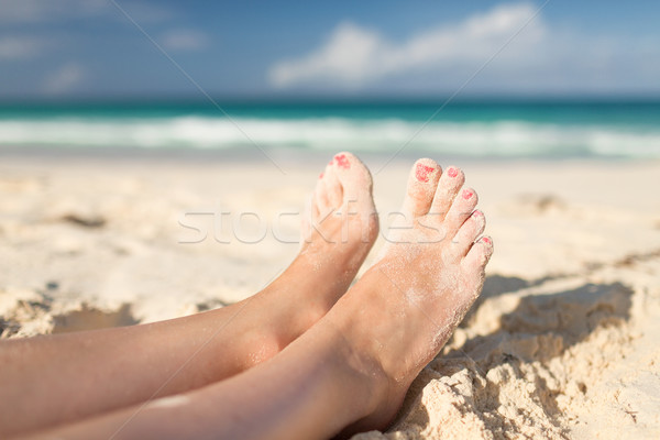 closeup of woman legs on sea shore Stock photo © dolgachov