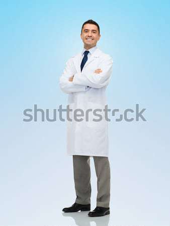 smiling male doctor in white coat Stock photo © dolgachov