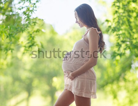 happy pregnant woman in chemise Stock photo © dolgachov