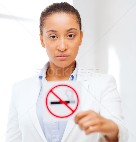 african woman with restriction no smoking sign Stock photo © dolgachov
