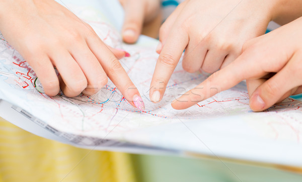 close up of women hands pointing finger to map Stock photo © dolgachov