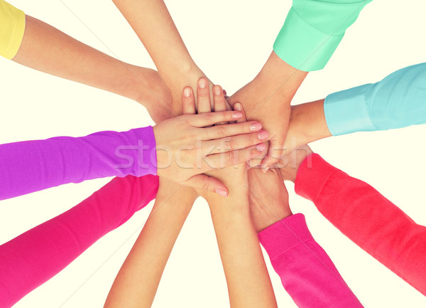 close up of women hands on top in rainbow clothes Stock photo © dolgachov