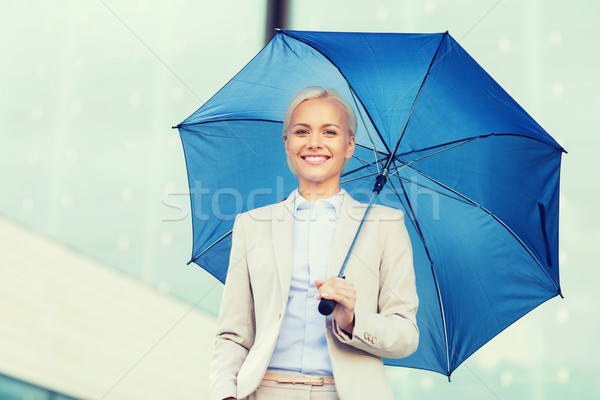 ストックフォト: 小さな · 笑みを浮かべて · 女性実業家 · 傘 · 屋外 · ビジネス