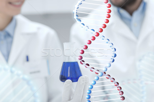 close up of scientists with test tube in lab Stock photo © dolgachov