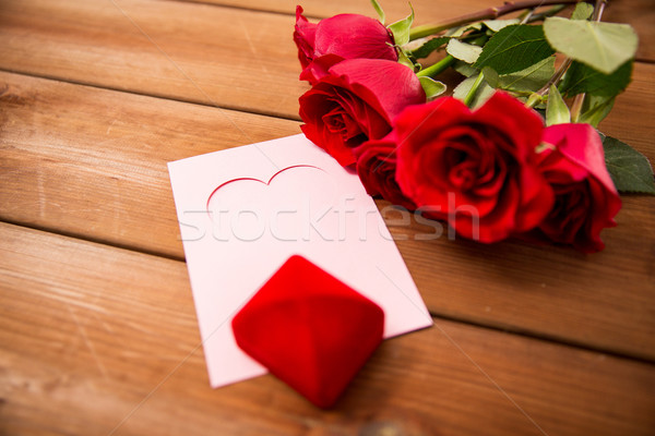 close up of gift box, red roses and greeting card Stock photo © dolgachov