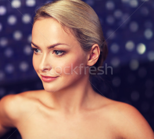 close up of young woman sitting in bath towel Stock photo © dolgachov