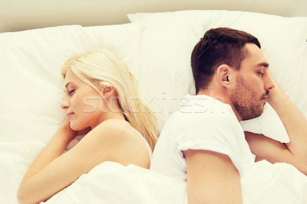 couple sleeping in bed at home Stock photo © dolgachov