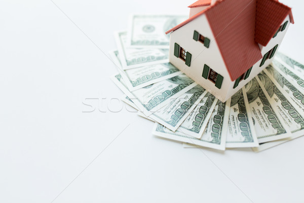 close up of home or house model and money Stock photo © dolgachov