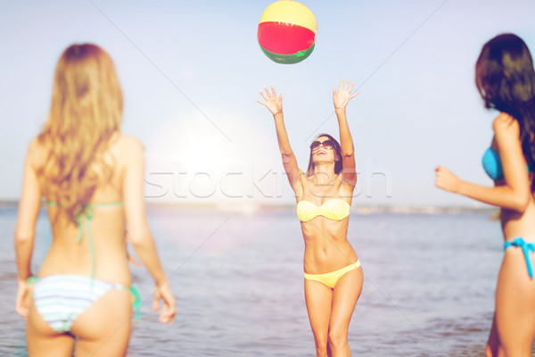 girls with ball on the beach Stock photo © dolgachov