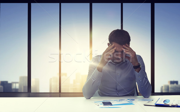 close up of anxious businessman with papers Stock photo © dolgachov