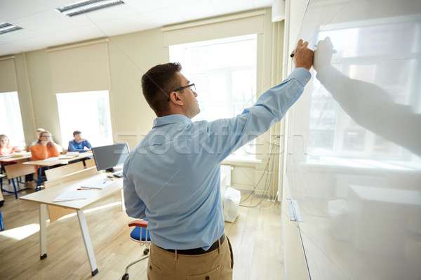 Öğrenciler öğretmen yazı okul beyaz tahta eğitim Stok fotoğraf © dolgachov