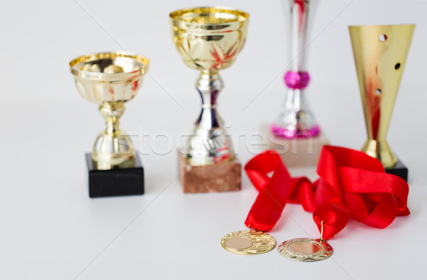 close up of sports golden cups and medals Stock photo © dolgachov