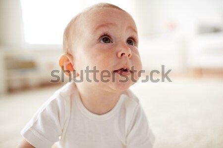 close up of happy little baby boy or girl at home Stock photo © dolgachov