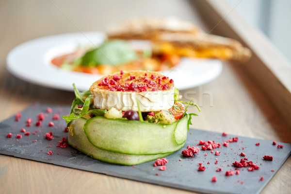 goat cheese salad with vegetables at restaurant Stock photo © dolgachov