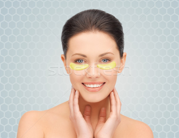 beautiful young woman face with under-eye patches Stock photo © dolgachov