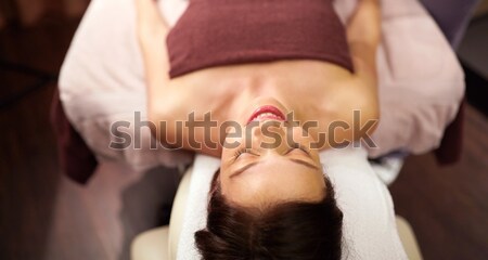 happy young woman lying at spa or massage parlor Stock photo © dolgachov
