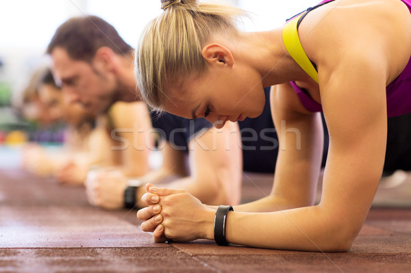 Stock photo: close up of woman at training doing plank in gym