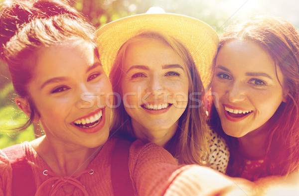 happy women or friends taking selfie at summer Stock photo © dolgachov