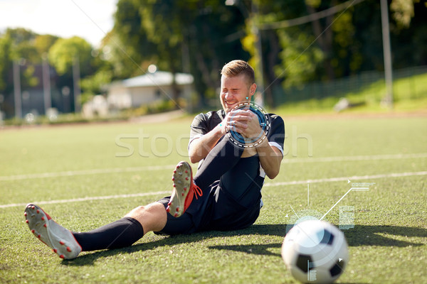 Ranny piłkarz piłka boisko do piłki nożnej sportu urazy sportowe Zdjęcia stock © dolgachov