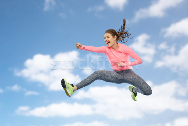 Stockfoto: Gelukkig · jonge · vrouw · springen · vechten · pose