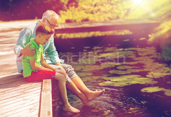 Grand-père petit-fils séance rivière famille génération [[stock_photo]] © dolgachov