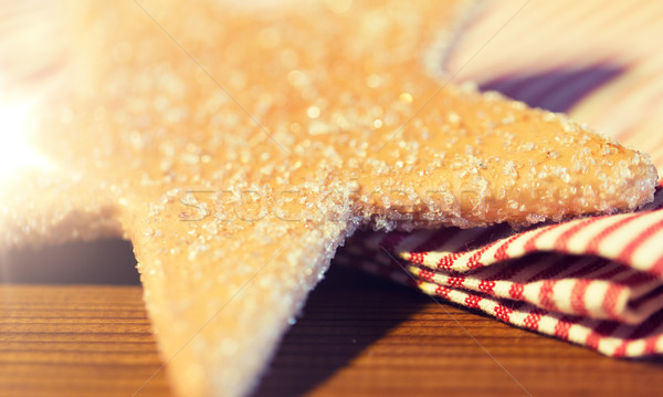 close up of star gingerbread cookie and towel Stock photo © dolgachov