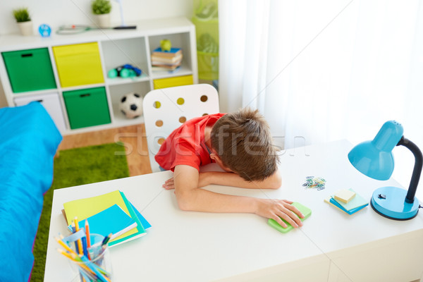 tired or sad student boy with smartphone at home Stock photo © dolgachov