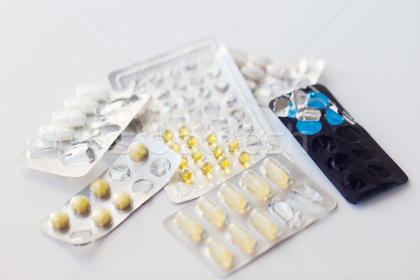 old open packs with pills and capsules of drugs Stock photo © dolgachov