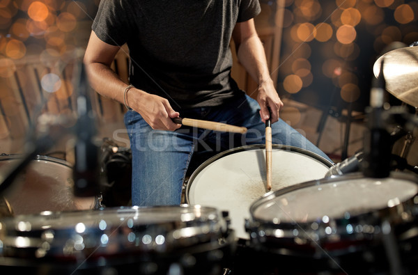 musician playing drum kit at concert over lights Stock photo © dolgachov