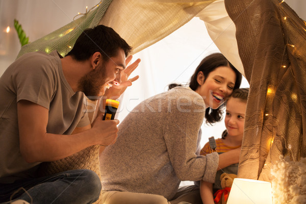 father telling scary stories to his daughter Stock photo © dolgachov