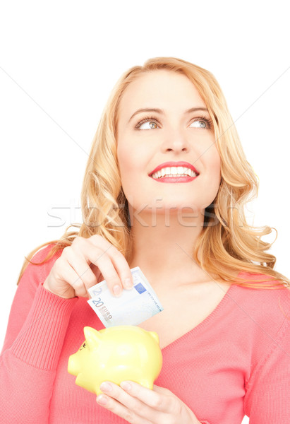 lovely woman with piggy bank and money Stock photo © dolgachov