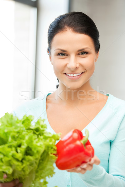 beautiful woman in the kitchen Stock photo © dolgachov