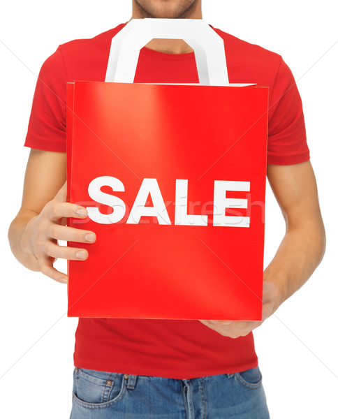 man's hands holding shopping bag Stock photo © dolgachov