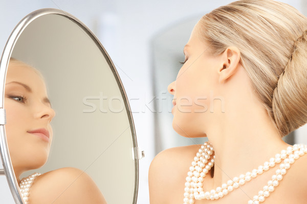 woman with pearl necklace Stock photo © dolgachov