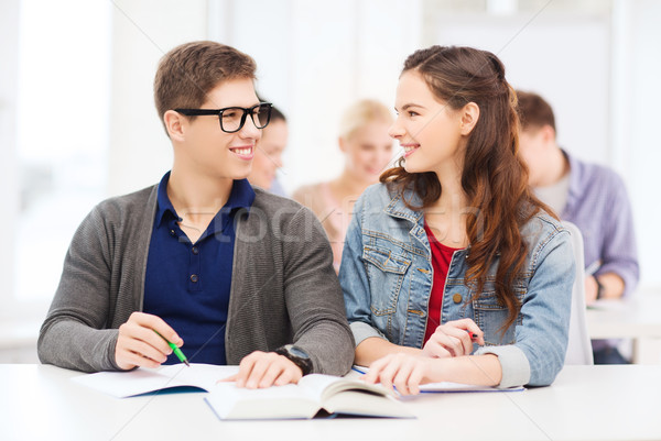 [[stock_photo]]: Deux · adolescents · ordinateurs · portables · livre · école · éducation