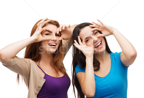two young teenagers making faces Stock photo © dolgachov