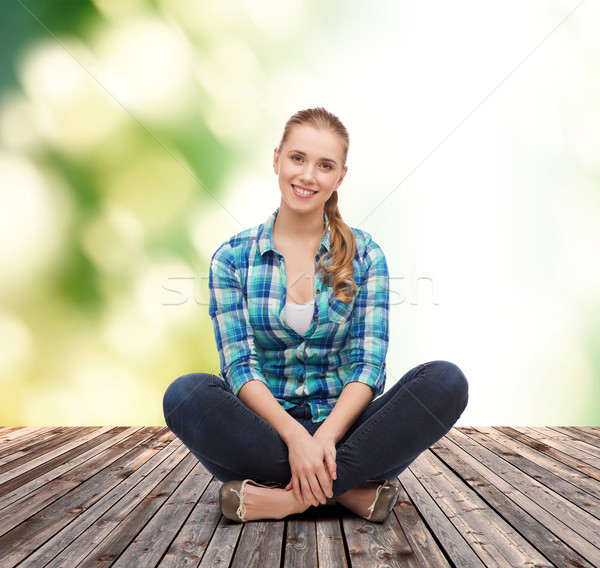 young woman in casual clothes sitting on floor Stock photo © dolgachov