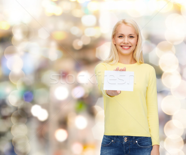 smiling girl with blank business or name card Stock photo © dolgachov